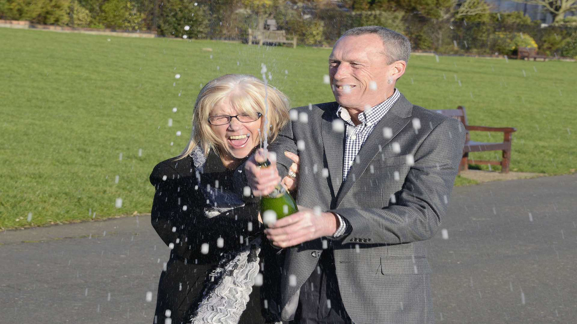 Marjorie and Alan pop the champagne to celebrate