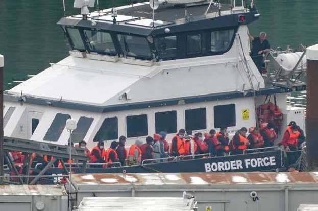 A group of people thought to be asylum seekers are brought in to Dover. Photo: Gareth Fuller/PA
