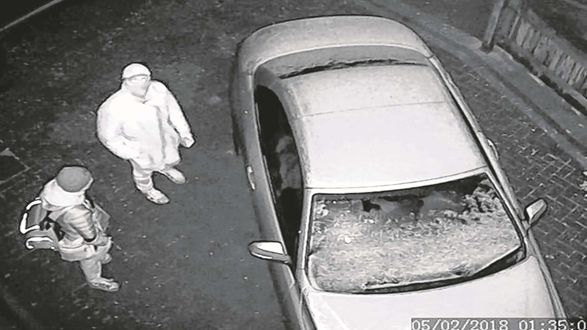 Thieves were seen approaching the vehicle.