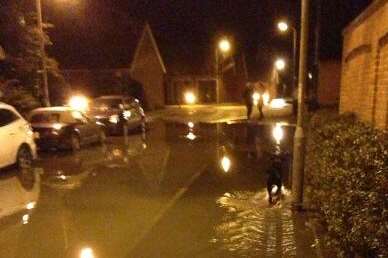 Water pouring in from Faversham Creek to Belvedere Road as the tide rises. Picture @Griseldamussett