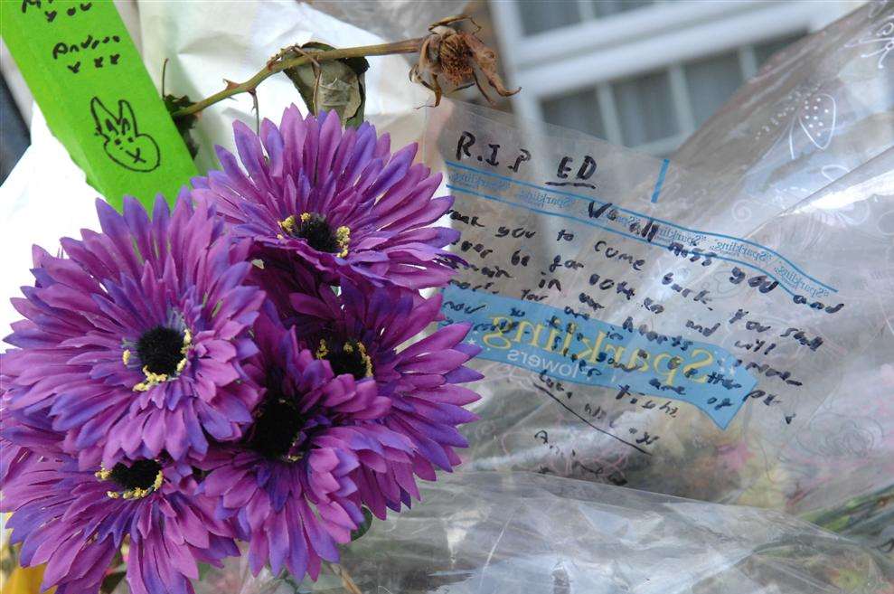 Flowers left outside the Gravesend flat where schoolboy Edward Barry was found dead