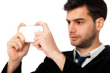 A man takes a picture with a camera phone. Picture: Thinkstock