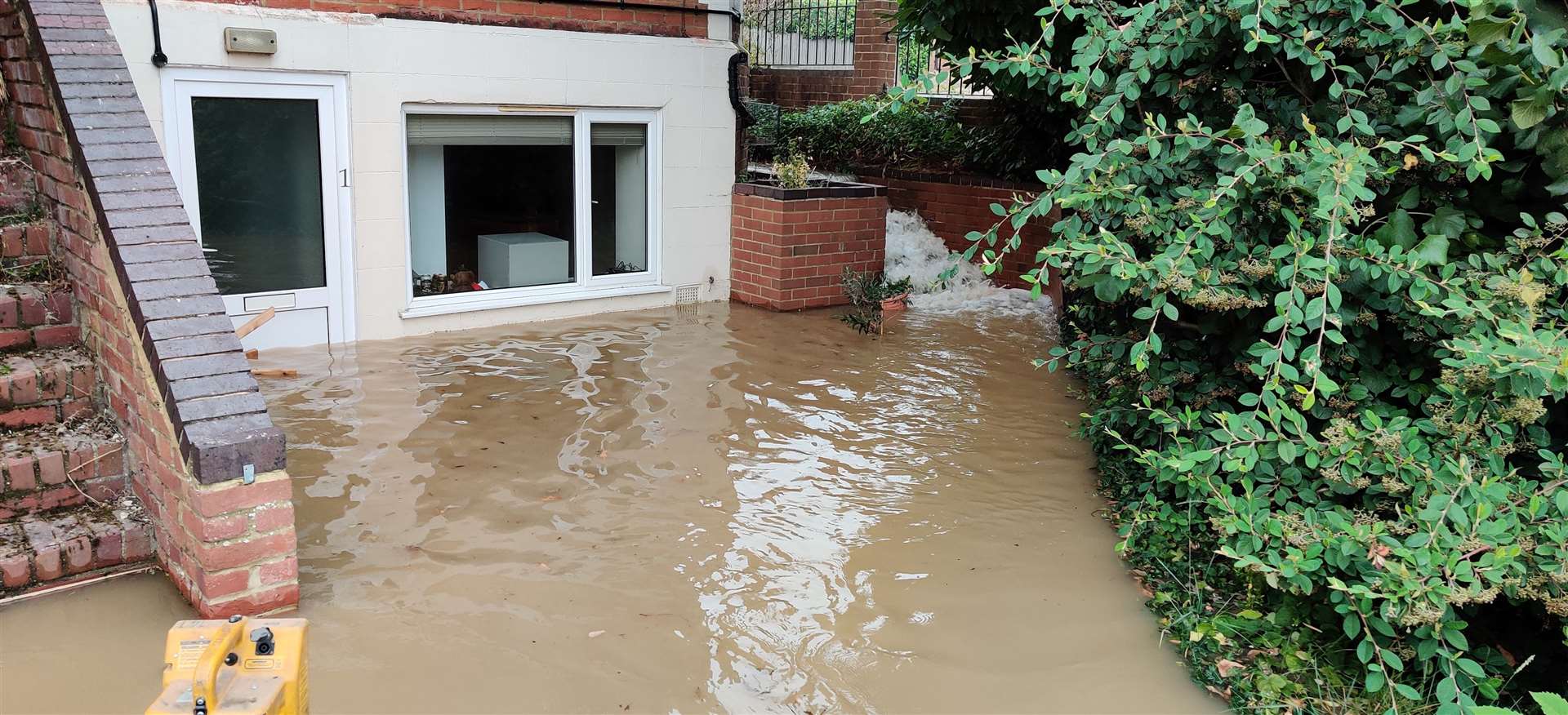 About two feet of water flooded properties after a main burst in Whitstable Road last month