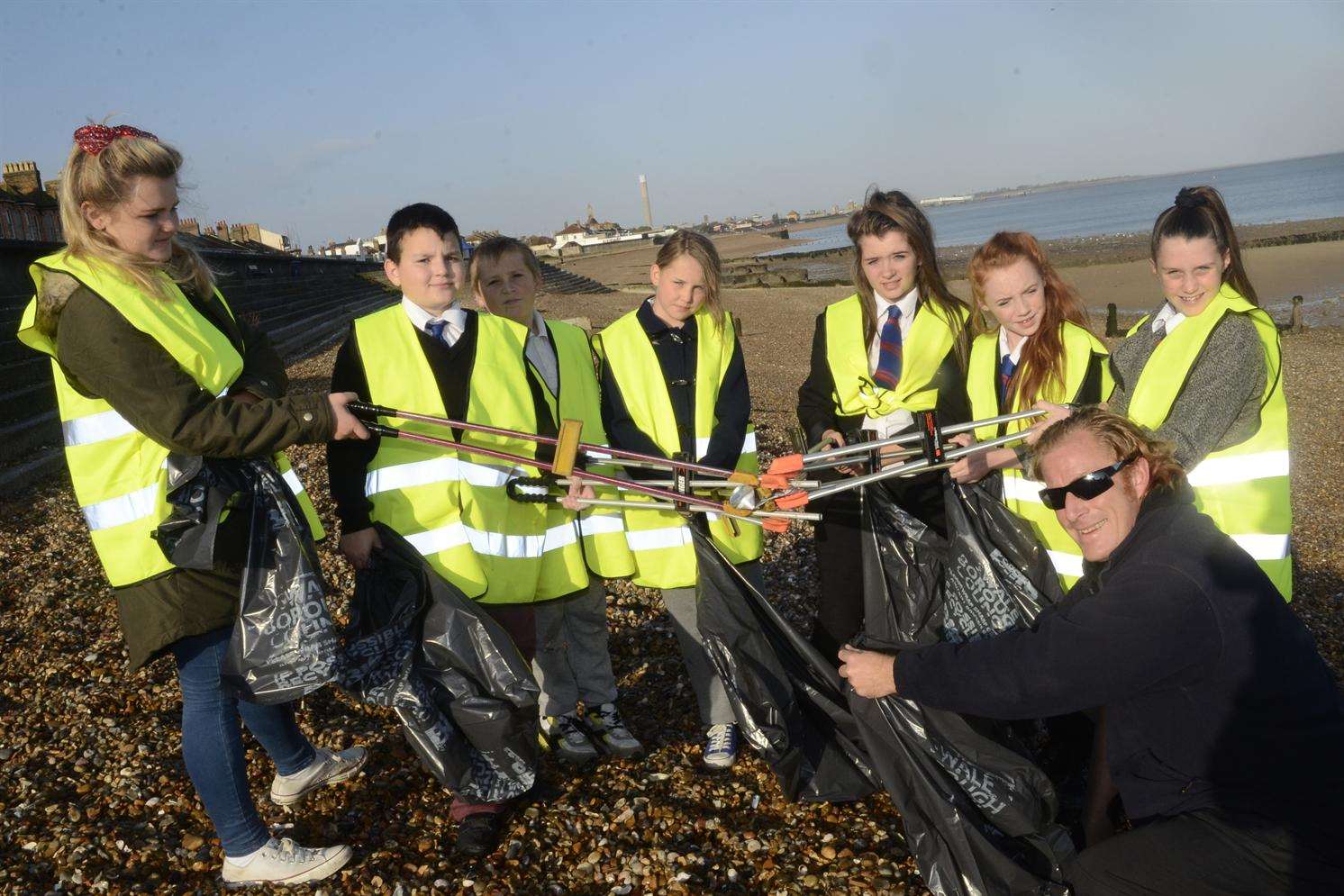 Seafront officer Ian Arnell with pupils from the Oasis Academy Sheppey who took part in the clean up of Sheerness beach