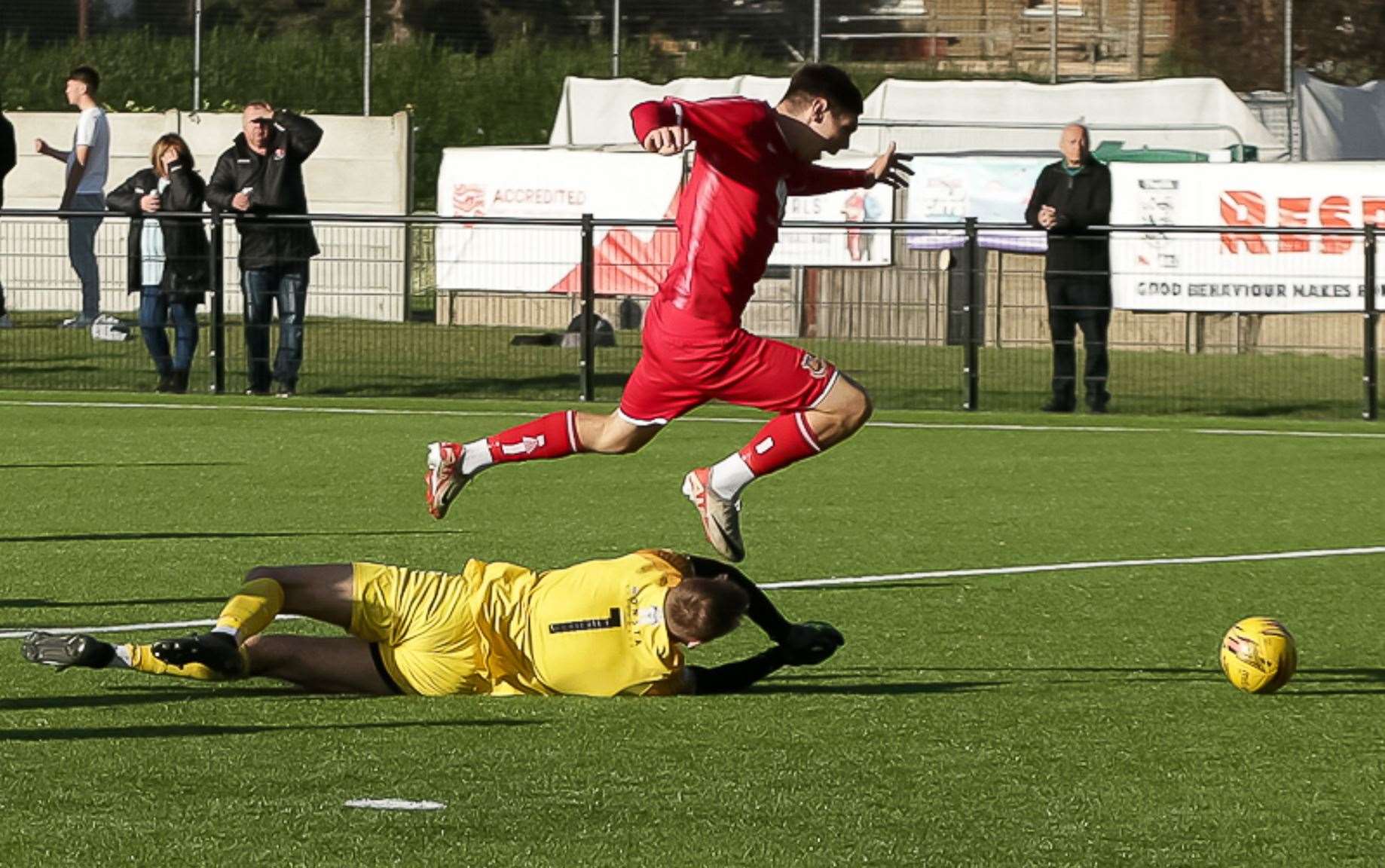 Whitstable’s Harvey Smith is brought down by visiting goalkeeper Luke Glover and wins a penalty. Picture: Les Biggs