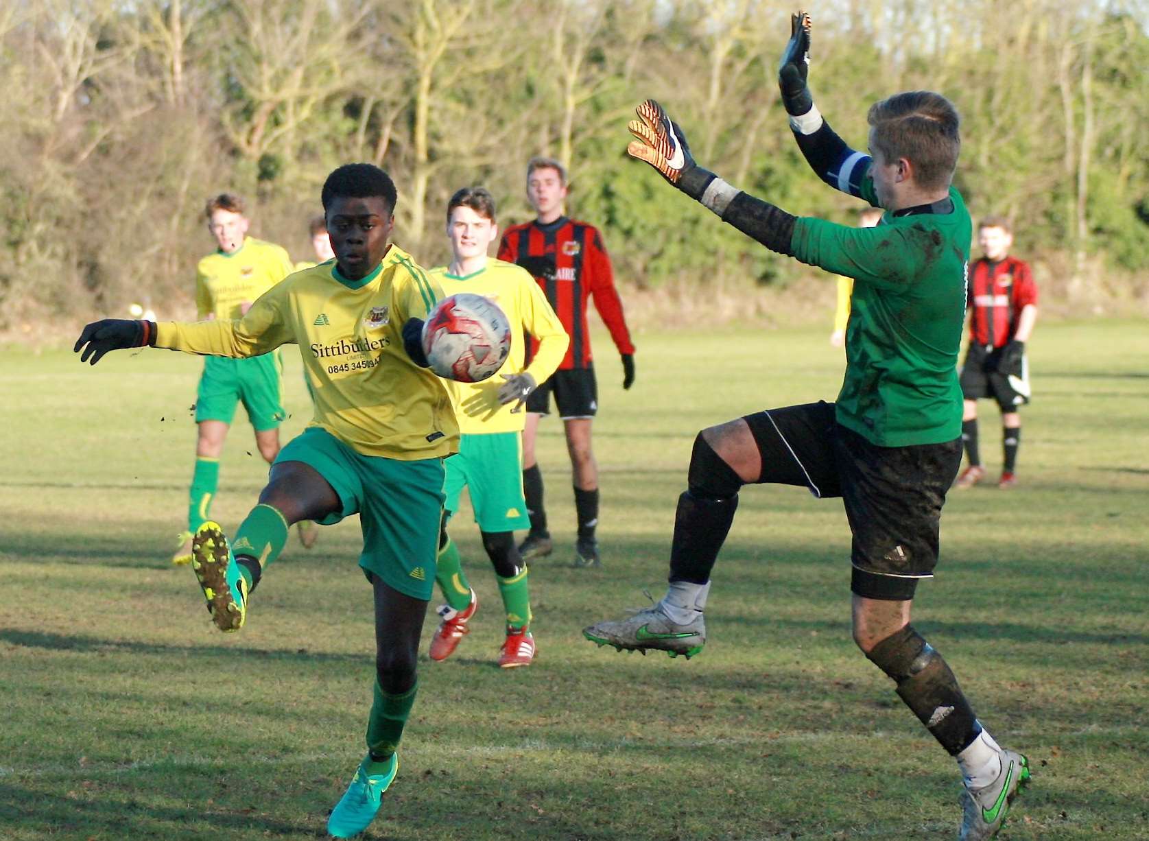 Woodcoombe Youth (yellow) and Woodcoombe Youth United under-18s go head-to-head in the League Cup second round Picture: Phil Lee