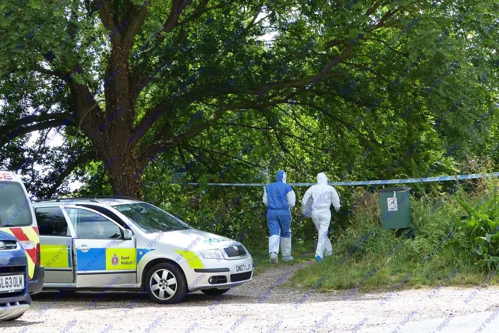 Forensic officers at the footpath in Green Lane, Hythe, where a woman was sexually assaulted. Picture: Kent999s