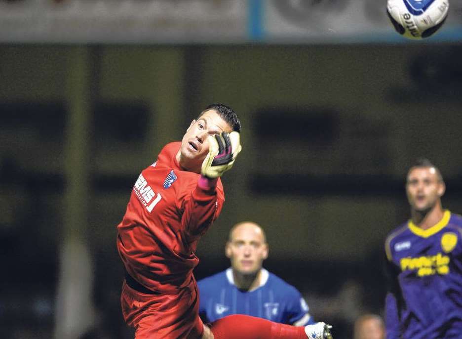 Gillingham keeper Stuart Nelson makes a save Picture: Barry Goodwin