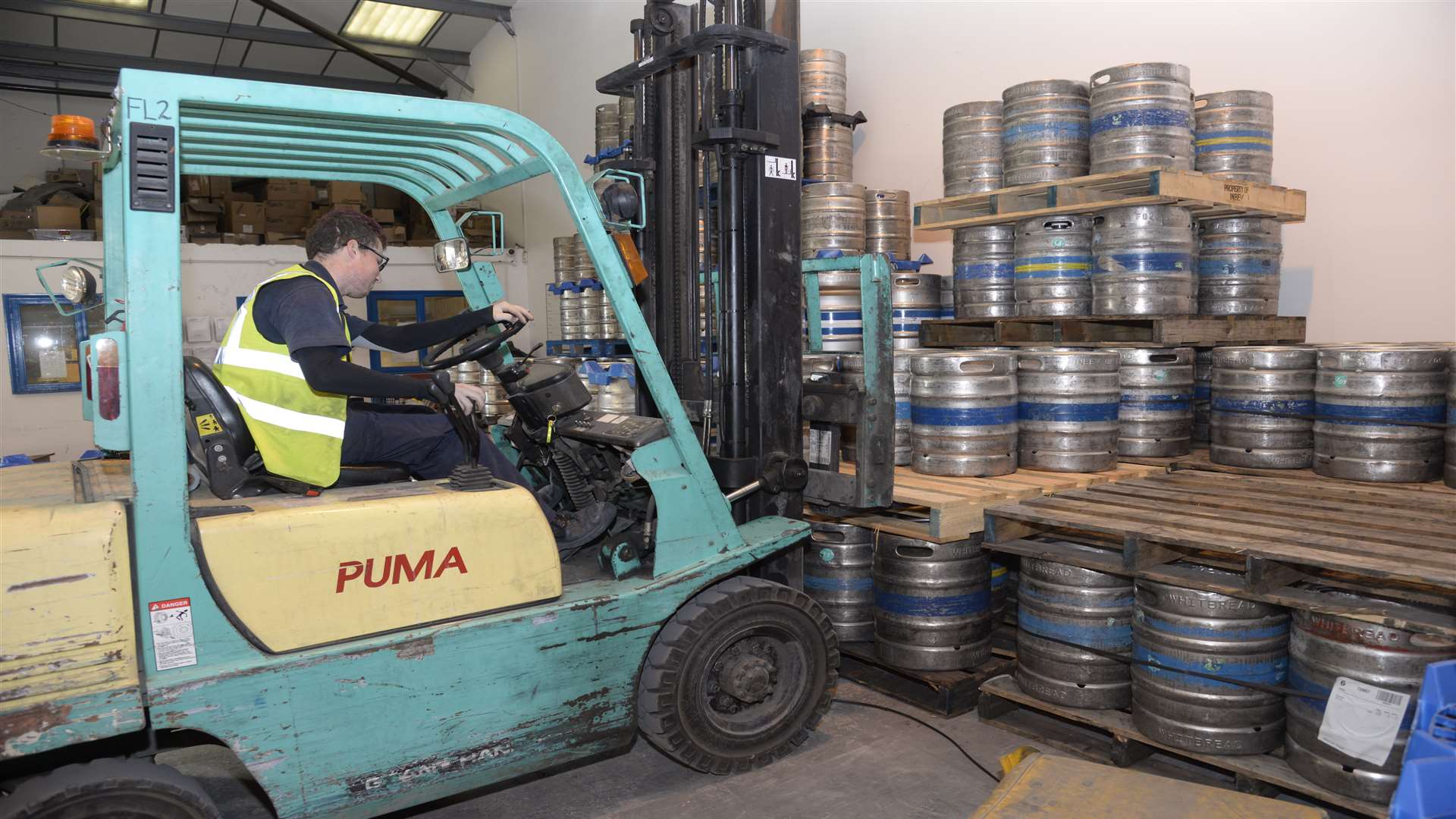 Fork lift truck driver Dom Chapman moves another consignment of kegs at Drink Warehouse UK