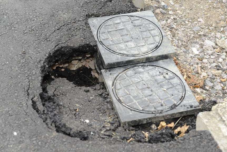 Hole in the pavement outside Bryan Mabb's home