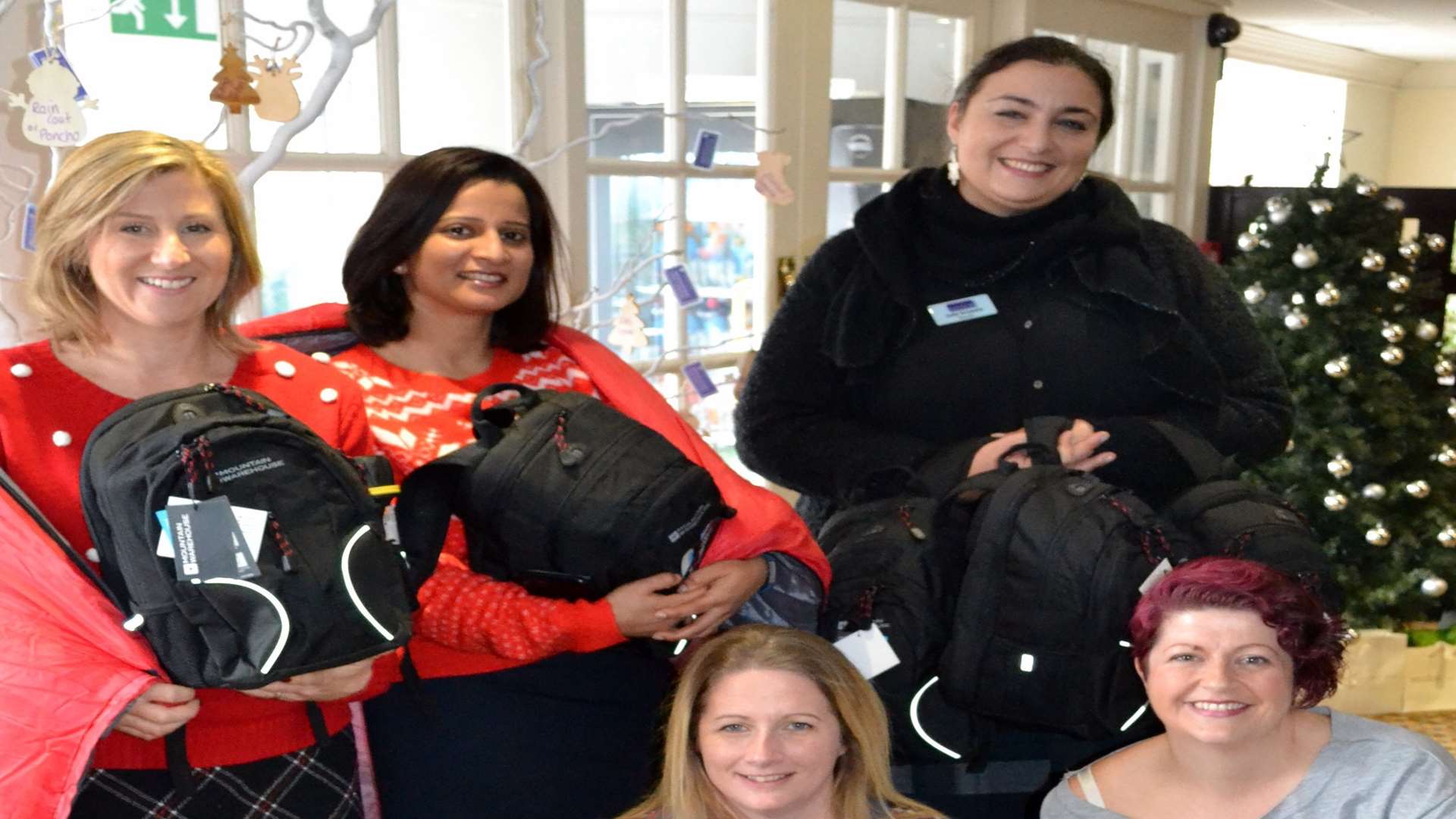 Zofia Grzymala, Maidstone Day Centre manager receives the filled rucksacks and sleeping bags from Tudor Park membership coordinator Tina Medcraft