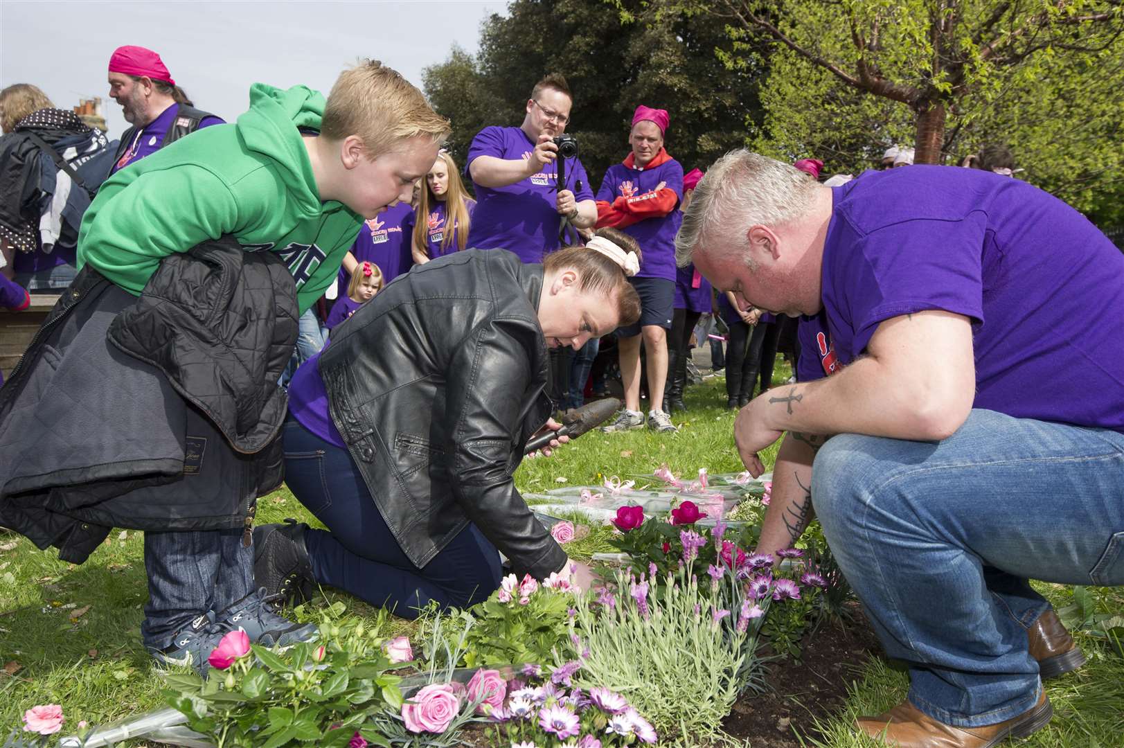 Watched by Stacey's brother Jake, mum Samantha Mowle and dad Warren Mowle plant roses in her memorial garden