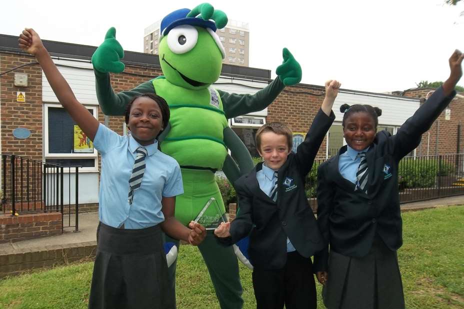 Peareswood Primary School pupils Debbie Taiwo, 10, Thomas Meagher, 10, Dara Amanor, 9, and Buster Bug celebrate the launch of KM Walk to School at Willow Bank Primary School, Bexley