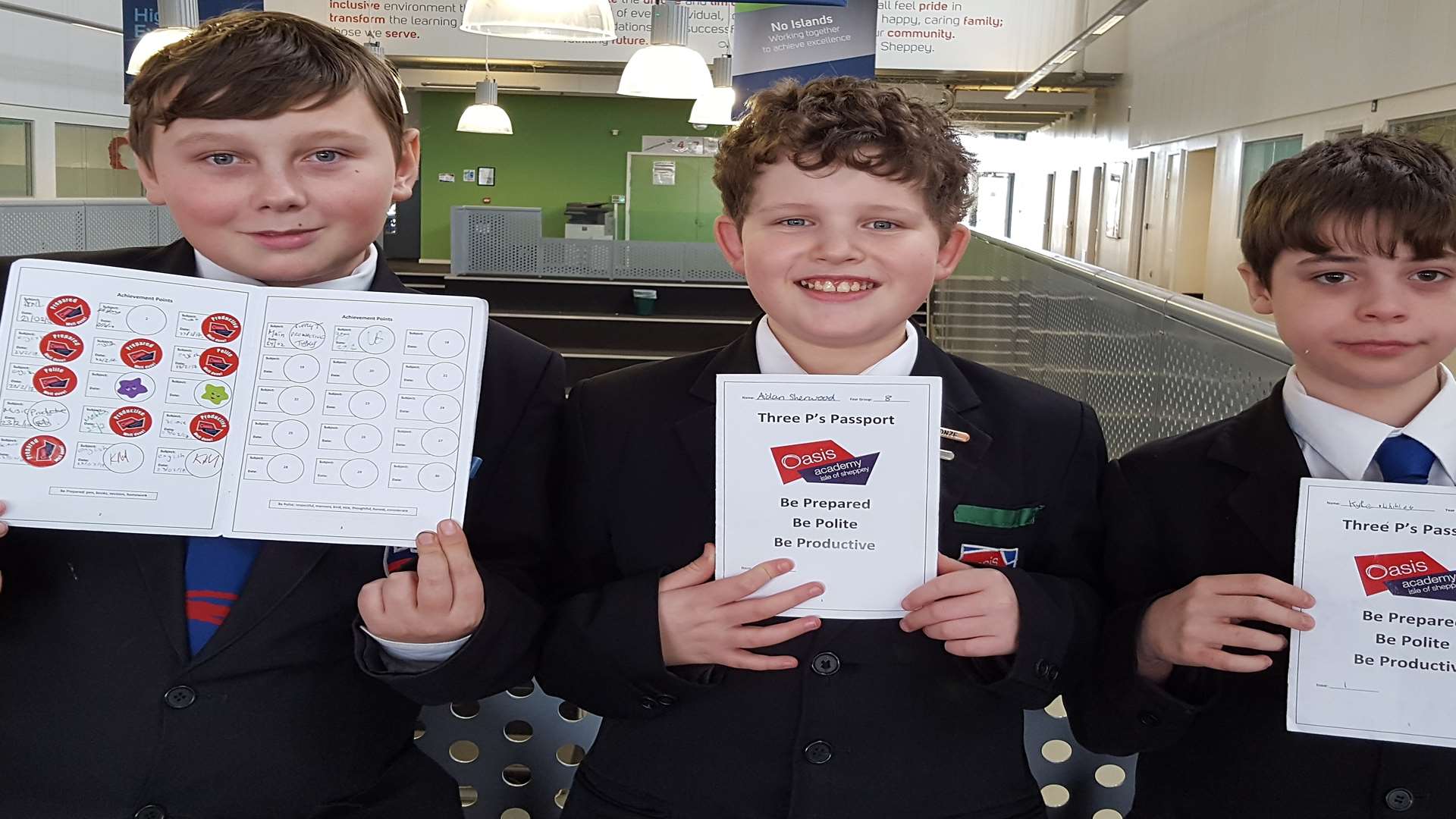 The passport has had a mixed reaction: Pupils Cody Hester, 13, Aidan Sherwood, 12, and Kyle Whibley, also 12