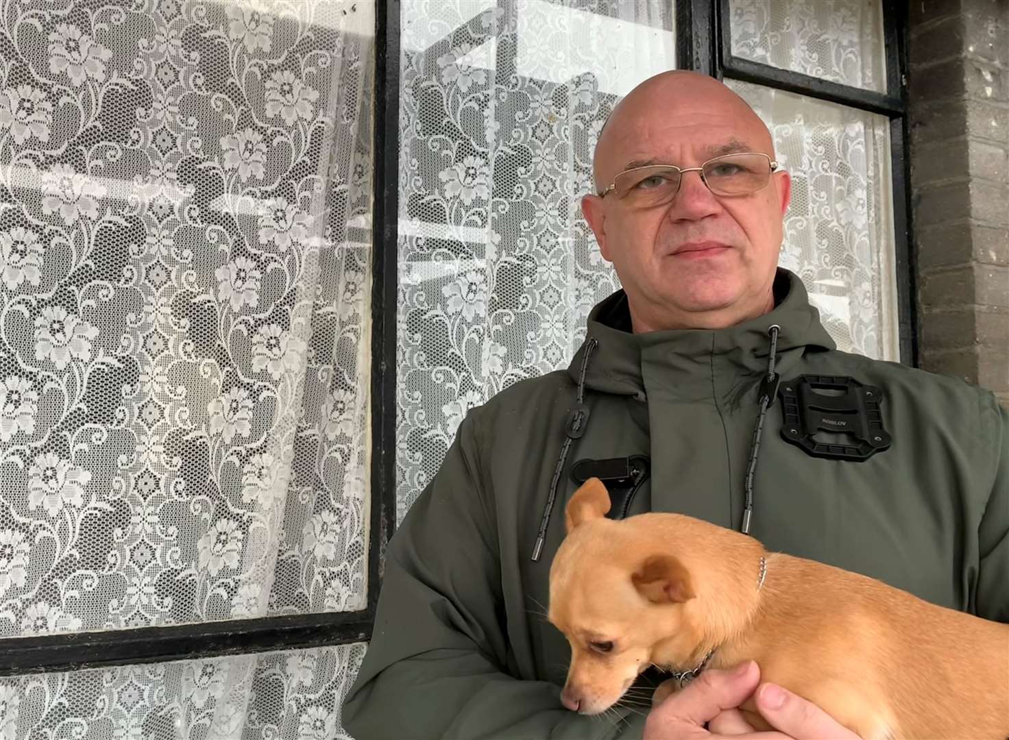 Margate resident Lyndon Brand, pictured with his dog Charlie, says Arlington House's windows are in disrepair
