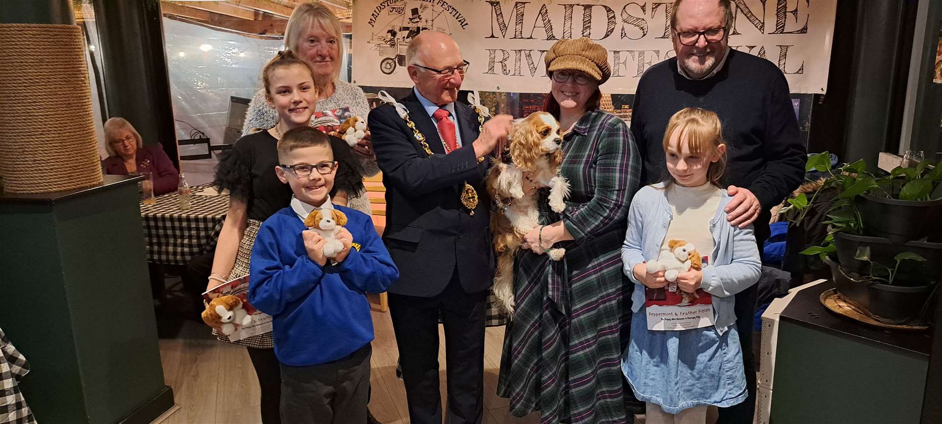 Winners of the children's competition to find hidden doggies at the festival, Kimberly, Jenson and Miley, pictured with the mayor and the organisers of the contest Clairey Suzanne and Marcus Niblett. Two other winners, Ava and Ellie, could not be present, but Ellie's mum is also pictured