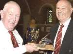 Colin Boswell, left, receives his award from league chairman Alan Barty. Picture: ANDY PAYTON