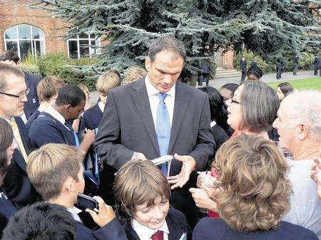 Former World Cup winning captain and current England rugby union coach Martin Johsnon signs autographs