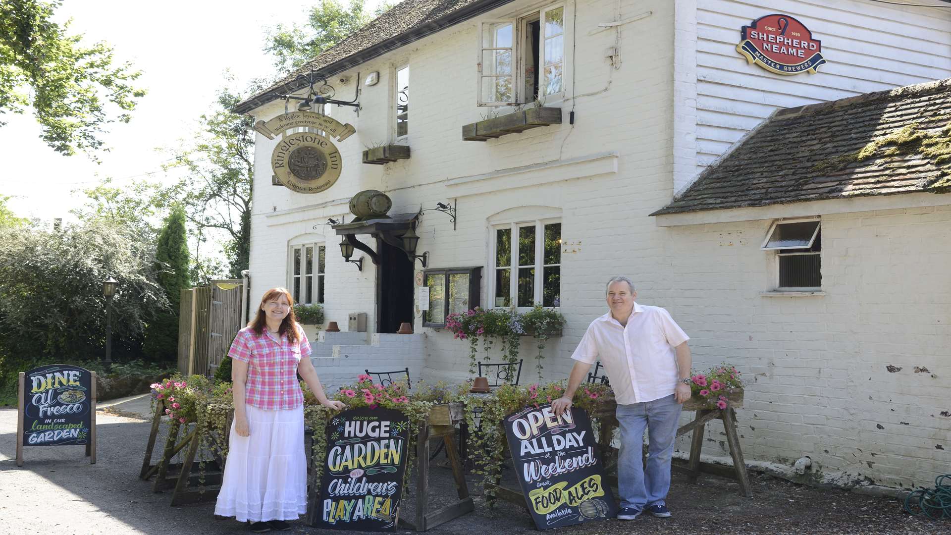 Christina Warren and Kevin De Young outside the Ringlestone Inn, which is now a PokéStop