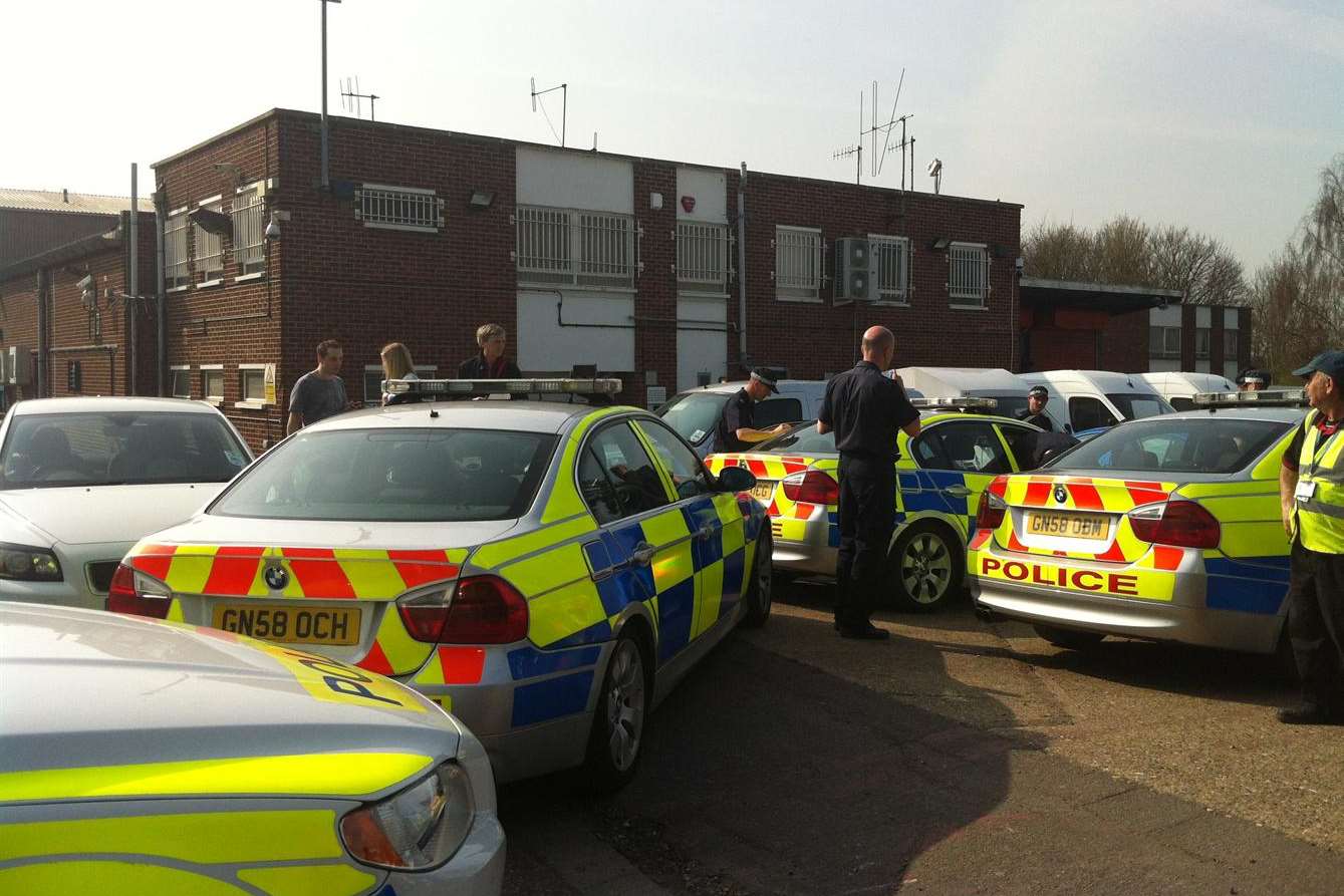 Dozens of police officers at the Loomis cash depot in Swanley