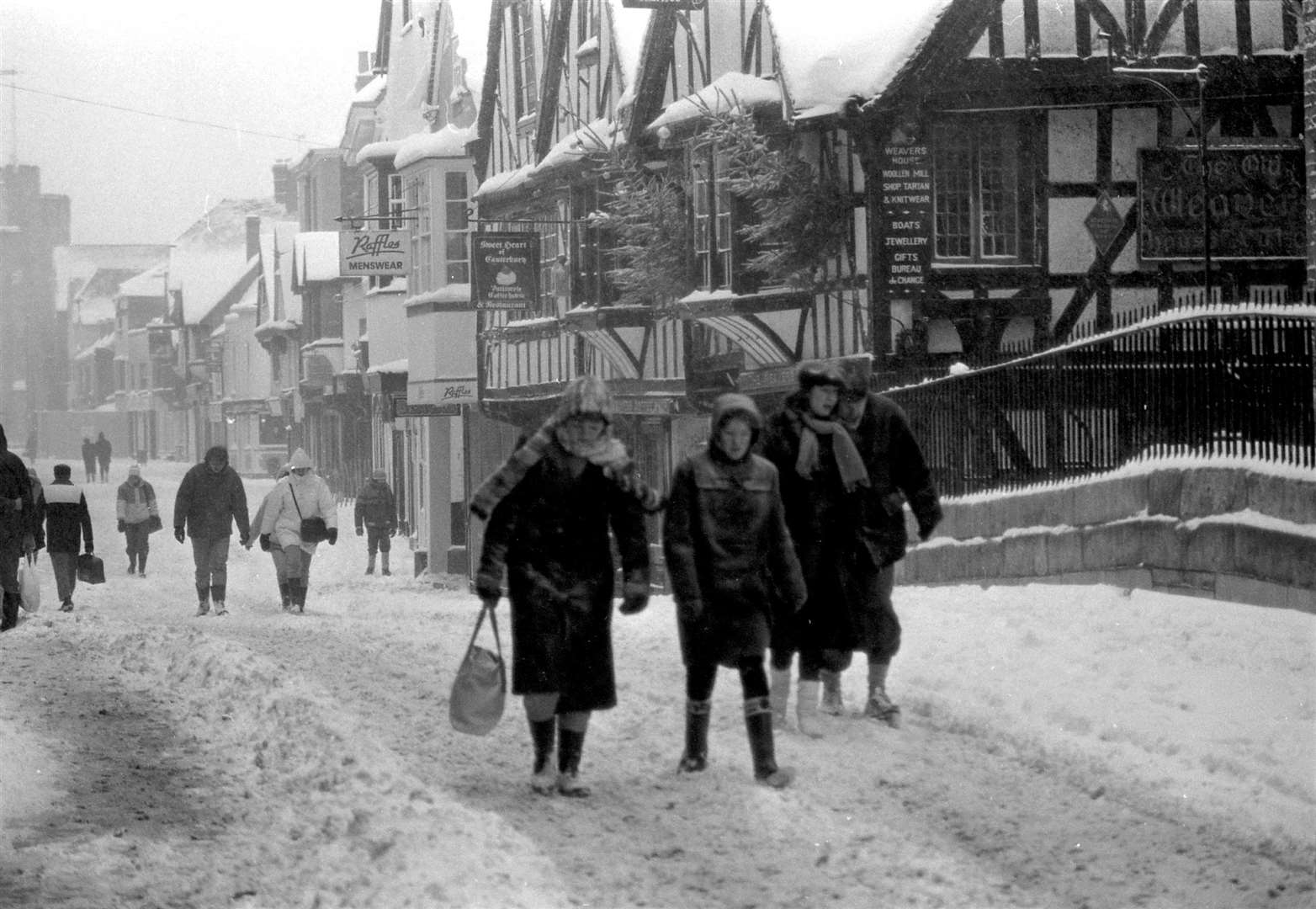 People making their way along Canterbury high street in the January blizzard
