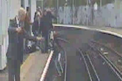 Passengers try to slow the train as the woman is trapped on the tracks at Strood. Picture: Southeastern