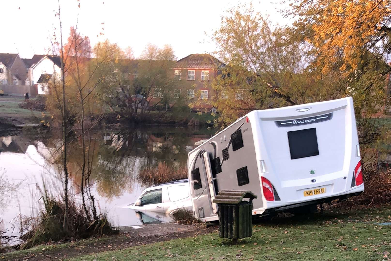 A 4X4 towing a caravan ended up in the lake off Newman Drive, Kemsley. Picture: James Spoerry