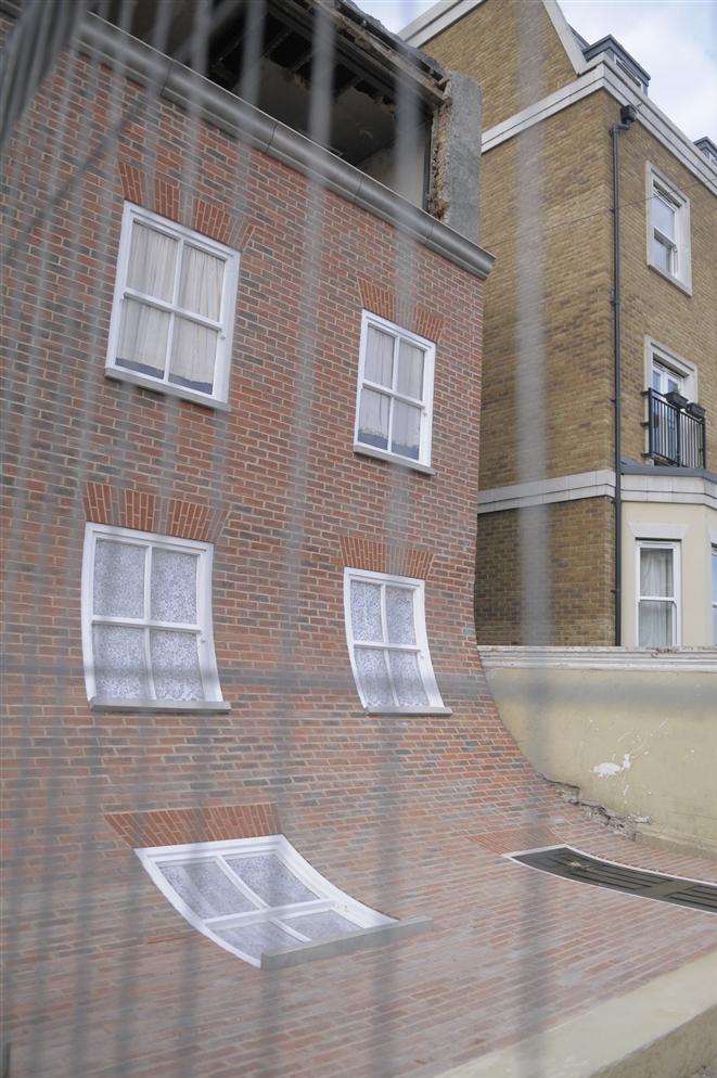 Even the door and windows of Alex Chinneck's 'home' appear to slide