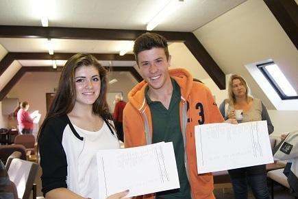 Imogen Oakes and George Dinnis collect their results at Bethany School.