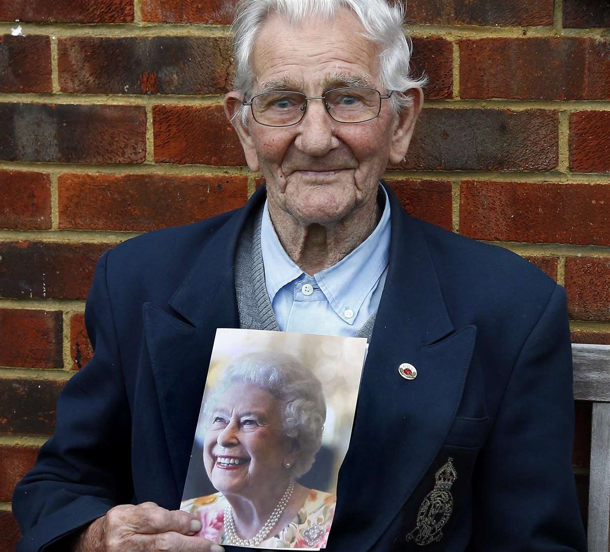 Leslie Stelfox 105 years old of Cherry Close, Sittingbourne, pictured with his card from the queen.Picture: Sean Aidan