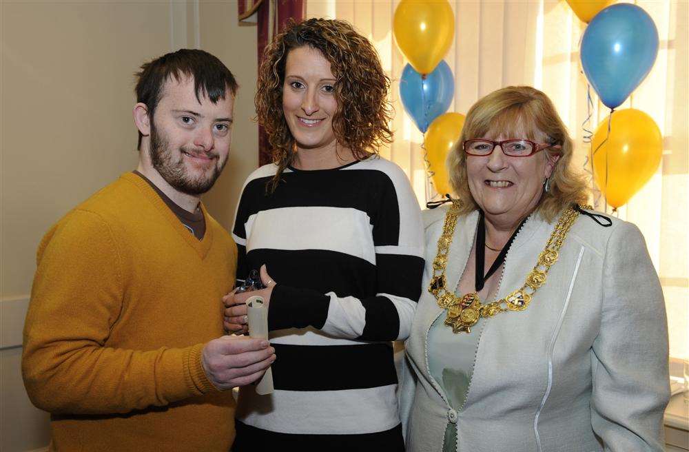 Kim Bladon (centre) from Pegasus Playscheme with her brother Jamie receives the award from Dover Mayor Cllr Anne Smith.