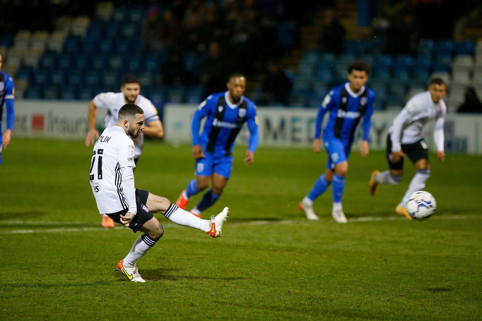 Conor Chaplin scores a penalty against Gillingham, making it 4-0 Picture: Andy Jones