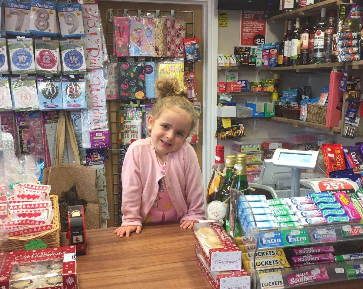 Nancy Sims, four, doing a shift at Sholden Village Store