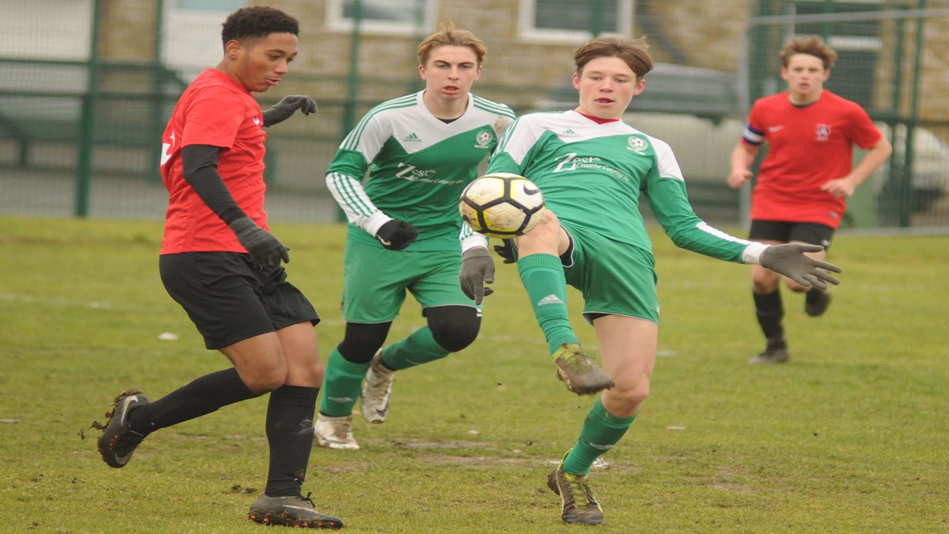 Eagles (green) get stuck in against Thamesview in Under-16 Division 2 Picture: Steve Crispe