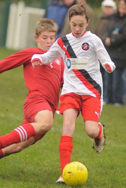 Istead Colts, red, tackle Rainham Kenilworth in their Under-14 Division 2 game. Picture: Steve Crispe