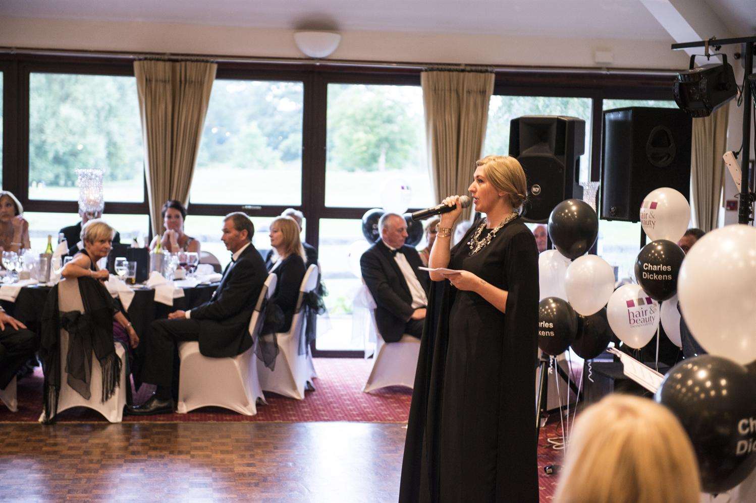 Hayley talks to diners at the charity ball at The Weald of Kent golf club Credit:Jacob Niblett photography