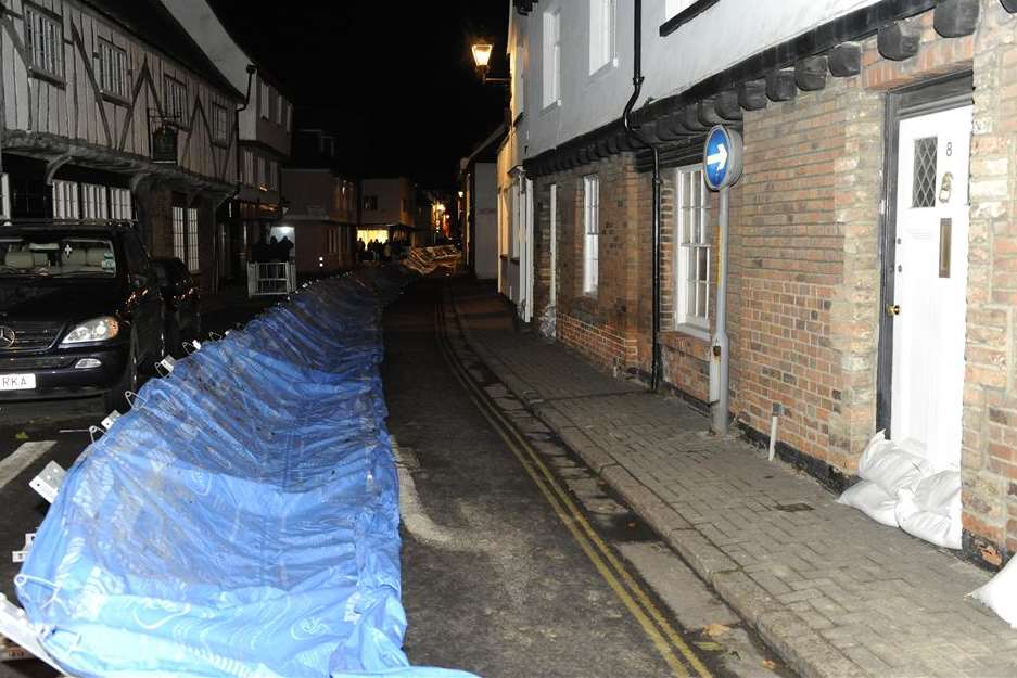 Many homes were protected by temporary barriers and sandbags in Sandwich, including these in The Strand. Picture: Tony Flashman
