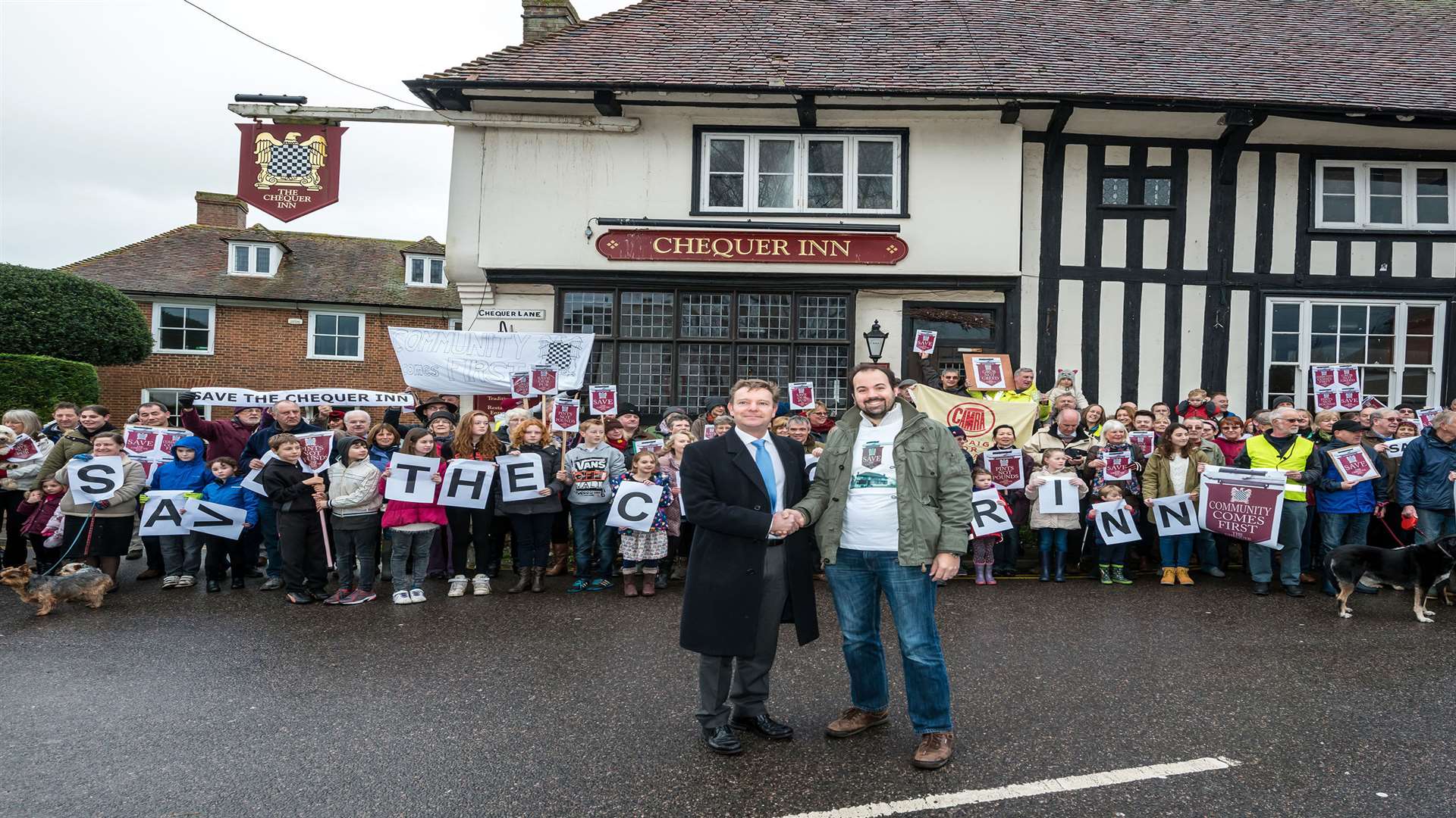 Campaigners outside the Chequer Inn in Ash, which they would like to keep as a pub