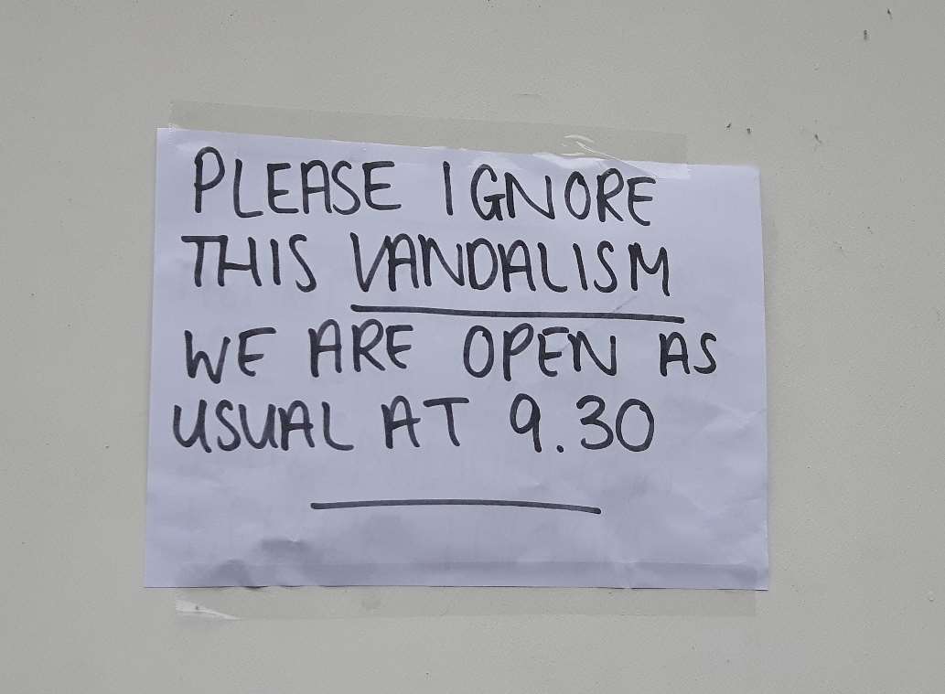 Hastily printed note on the front door of Barclays Bank, Sheerness, this morning telling customers the branch was open as usual