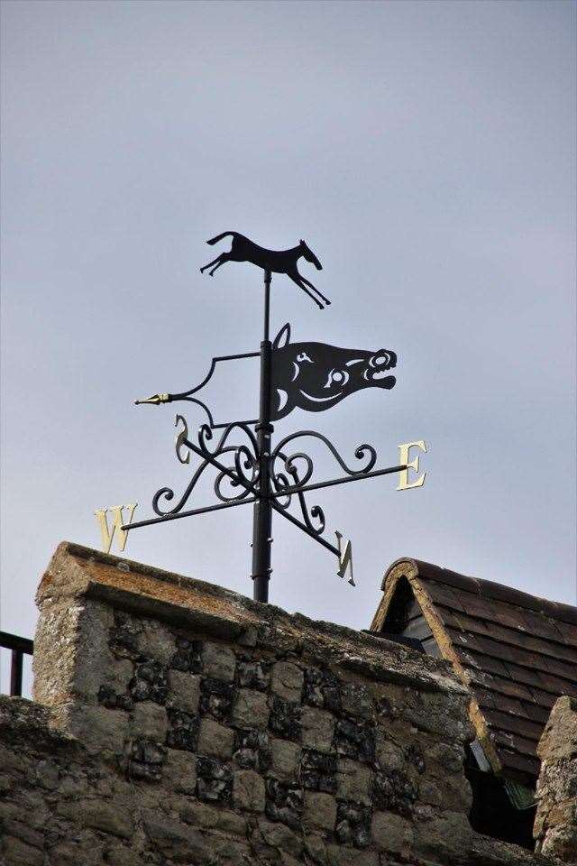 Grey Dolphin weather vane above the Abbey Gatehouse Museum at Minster, Sheppey