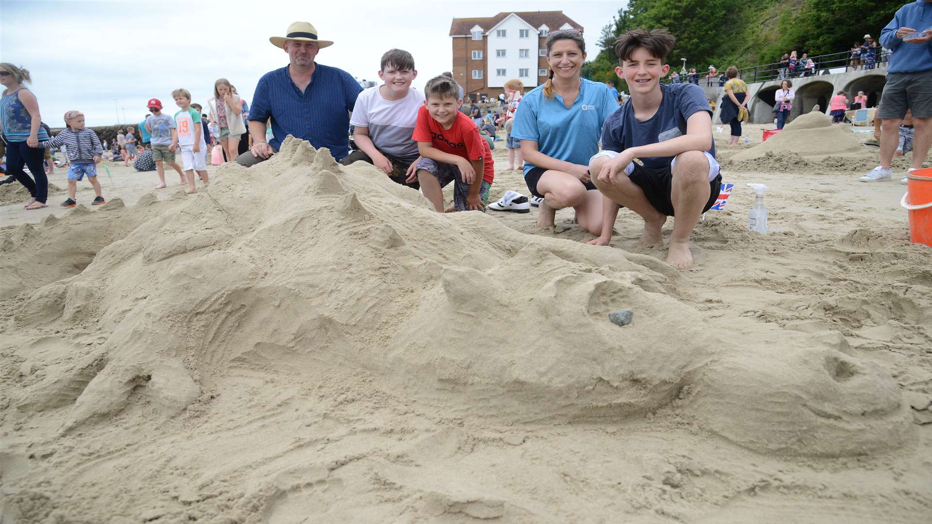 The Hoppies show off their sandy creation. Picture: Gary Browne