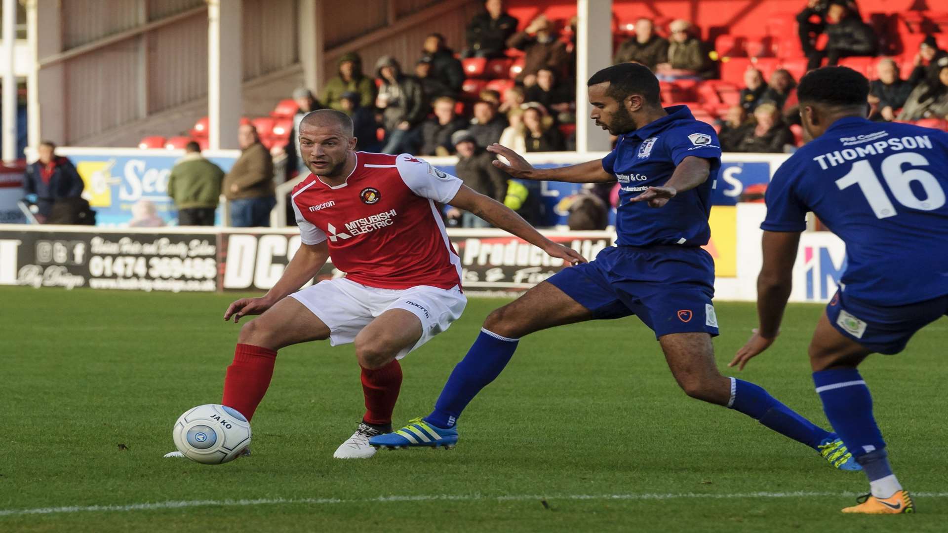 Luke Coulson tries to find a way through the Barrow defence Picture: Andy Payton