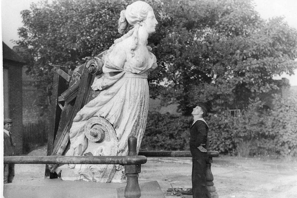 A sailor admires the Arethusa figurehead long before her restoration. Picture: Mary Stevens.