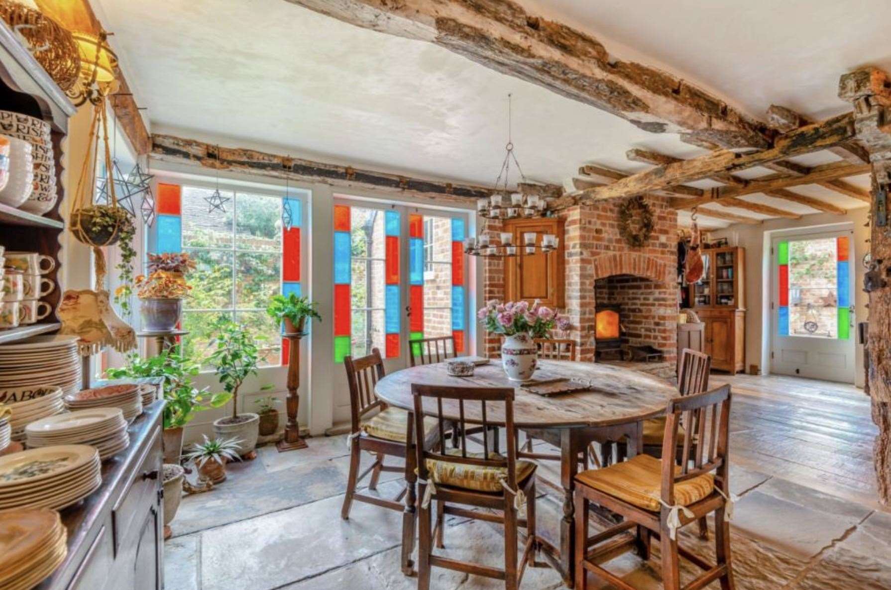 Stained glass windows are a feature inside the breakfast room. Picture: Strutt & Parker