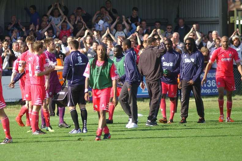 Dover players and fans celebrate after Whites' 3-0 win at Sutton which gave them a 4-1 aggregate Skrill South semi-final play-off success. Picture: Osman Deen / Surrey Comet