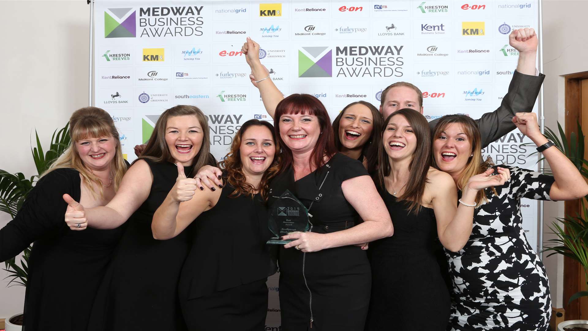 Jo Watson, centre, celebrates Best Newcomer award with her Scallywags team in 2015