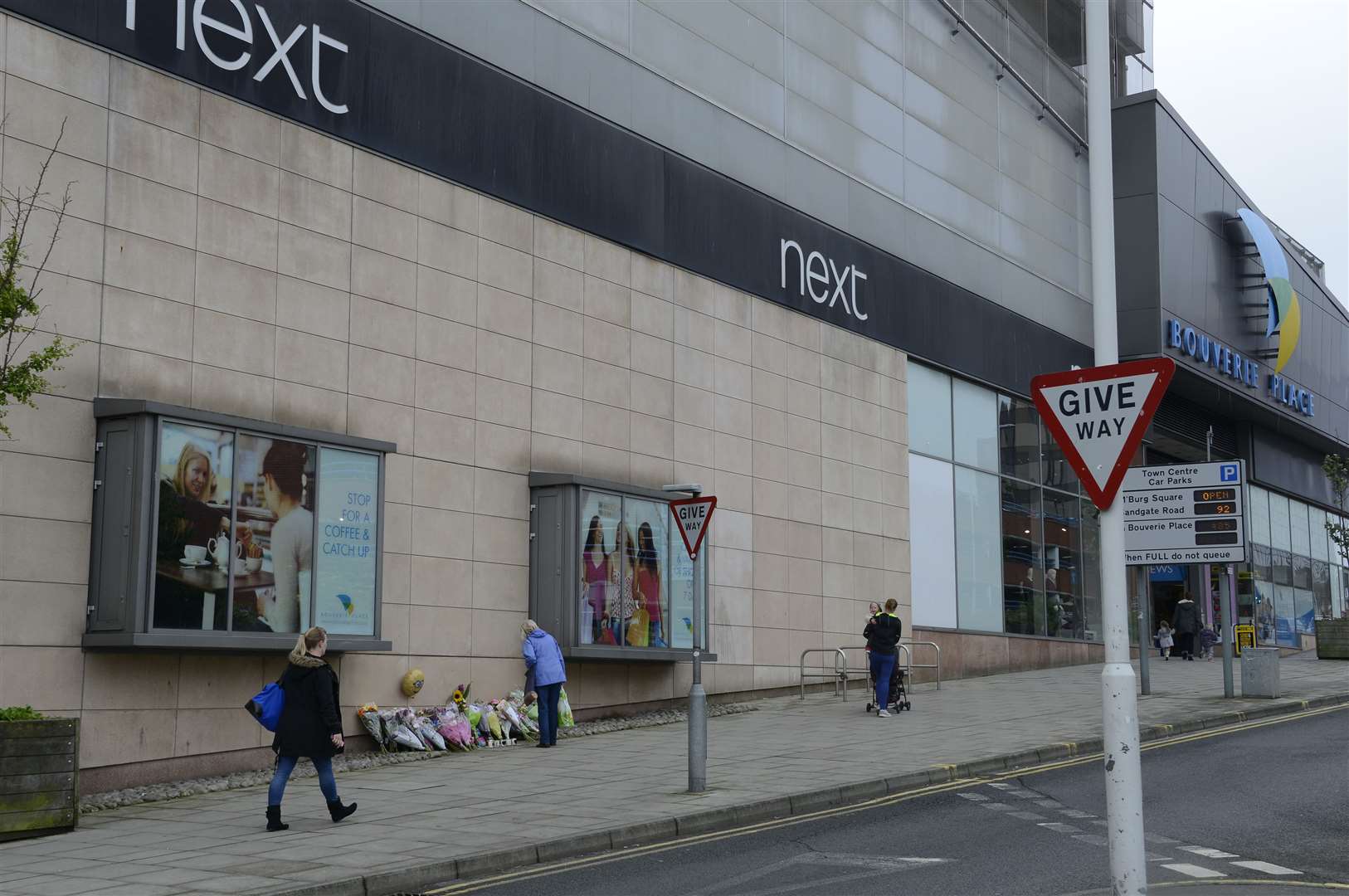 Flowers were laid against the Bouverie Place shopping centre, below Asda