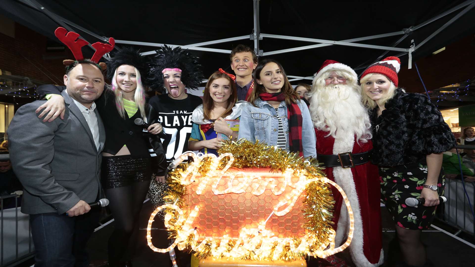 kmfm's Garry Wilson with Blonde Electra, the cast of Snow White, Made in Chelsea star Lucy Watson, Father Christmas and kmfm presenter Emma Adam turn on the all-important lights