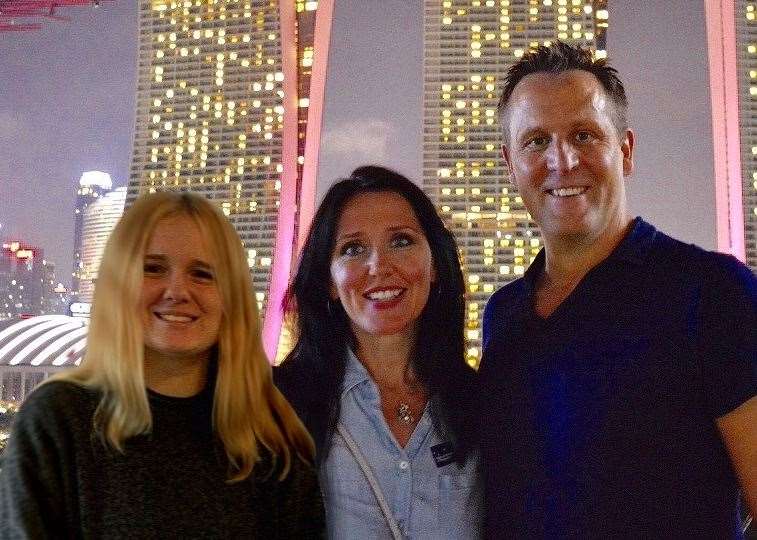 Mr and Mrs Hanvik with their daughter Ella Ransom in Singapore, where part of the book is based