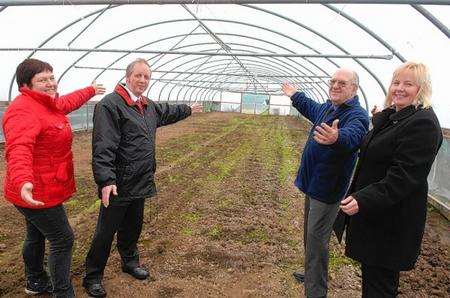 Community gardener Nicola Waghorne, Nigel Martin and Mike Brown of Sheppey Matters, with Dawn Mauldon, head of rehabilitation at Sheppey Prisons, in one of the polytunnels given over for use as allotments near Eastchurch Prison